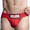 Red oxjok branded briefs with black and white logo patch on waistband from oxballs slingjock upthrust slider strap l