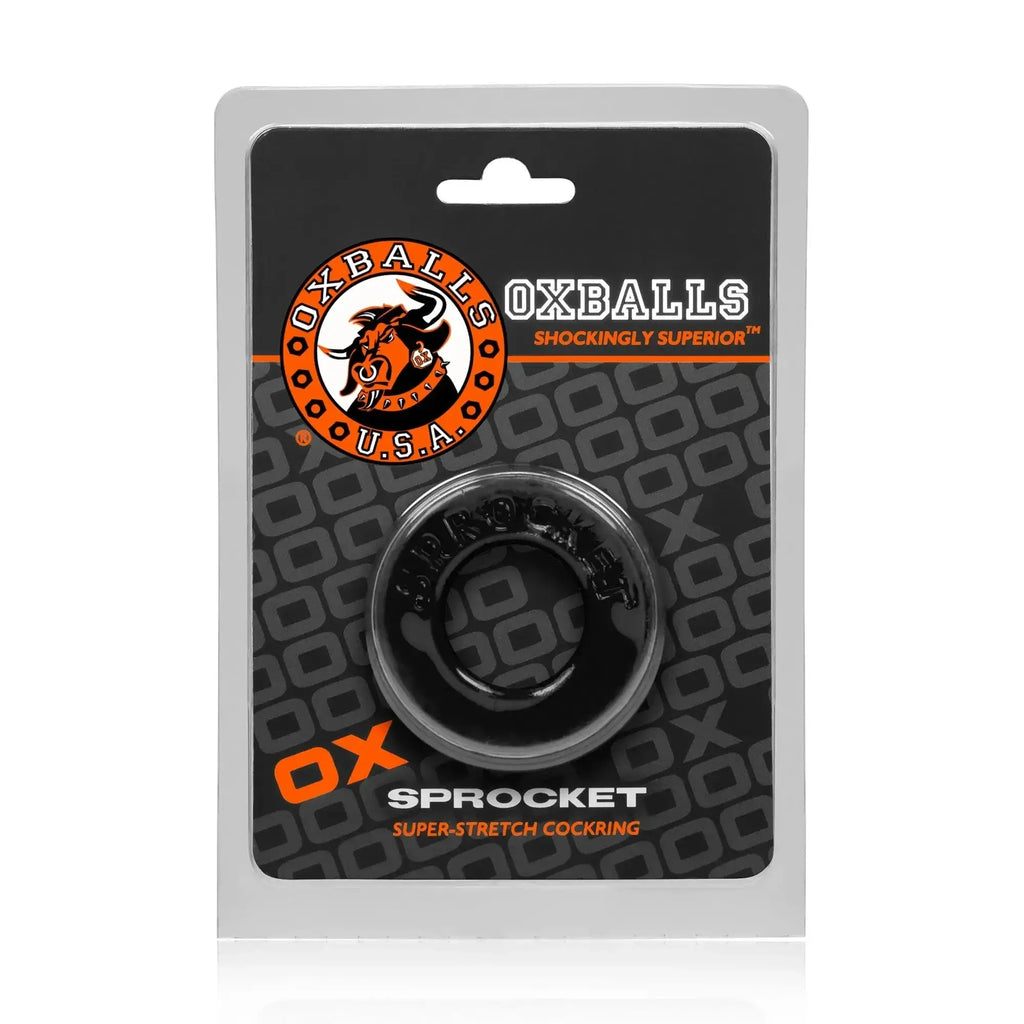 Black oxballs sprocket super-stretch cockring in clear plastic packaging showing the front label and ring details