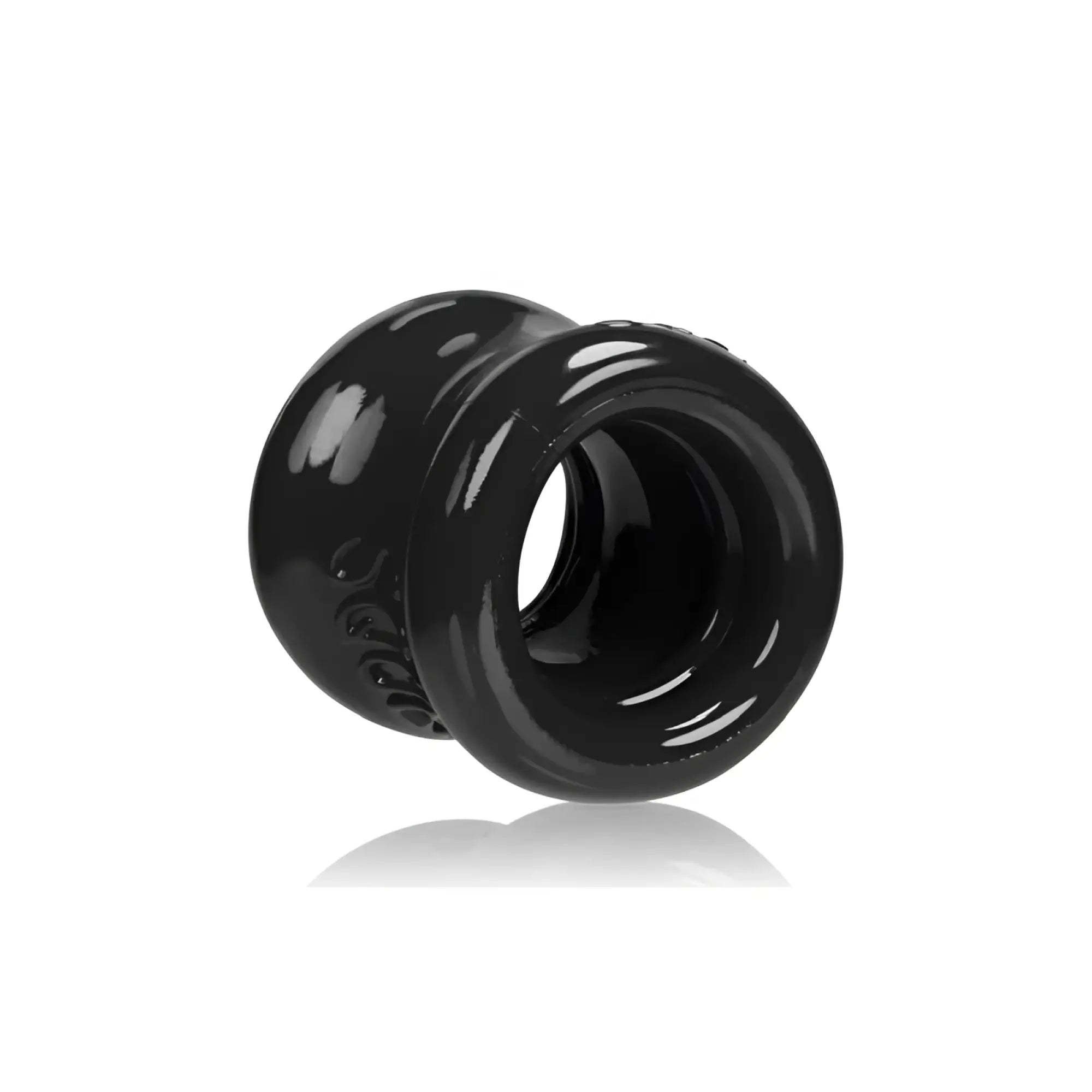 Black glossy silicone anal plug oxballs squeeze ball stretcher with textured outer surface and smooth inner bore