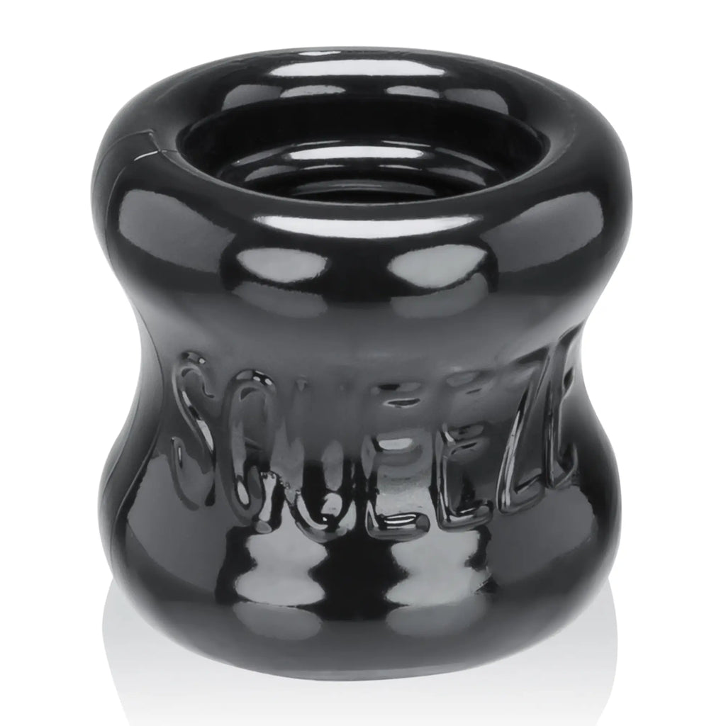 Black glossy silicone OxBalls squeeze ball stretcher with embossed squeeze lettering for comfortable use