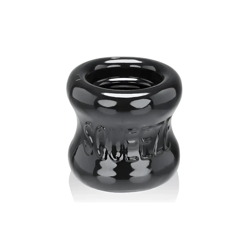 Black glossy silicone squeeze ring with embossed oxballs branding for ball stretcher use