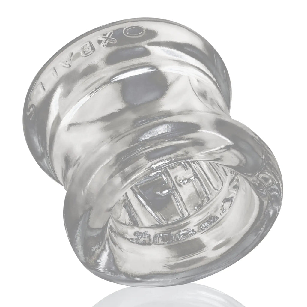 Clear oxballs squeeze ball stretcher glass plug with smooth rounded design and embossed branding on top