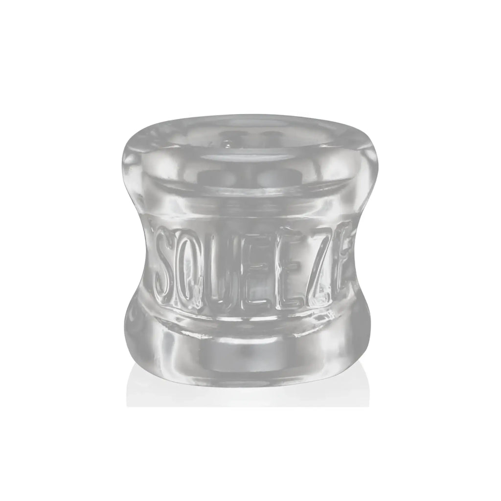 Clear silicone OxBalls squeeze ball stretcher ring with embossed squeeze text for comfortable wear
