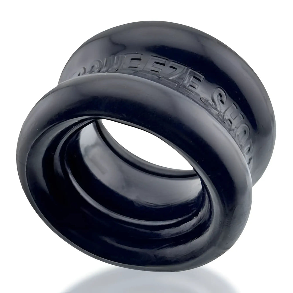 Black silicone squeeze ring with embossed oxballs branding in one size for short ballstretcher use