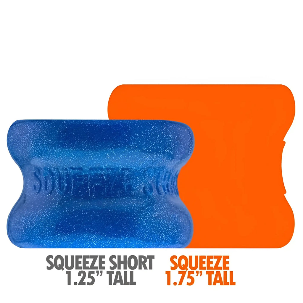 Oxballs squeeze short ballstretcher blue fire glittery silicone squeeze toy beside an orange size comparison
