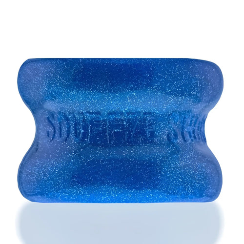 A vibrant blue glittery silicone bone-shaped squeeze toy with embossed text from oxballs squeeze short ballstretcher