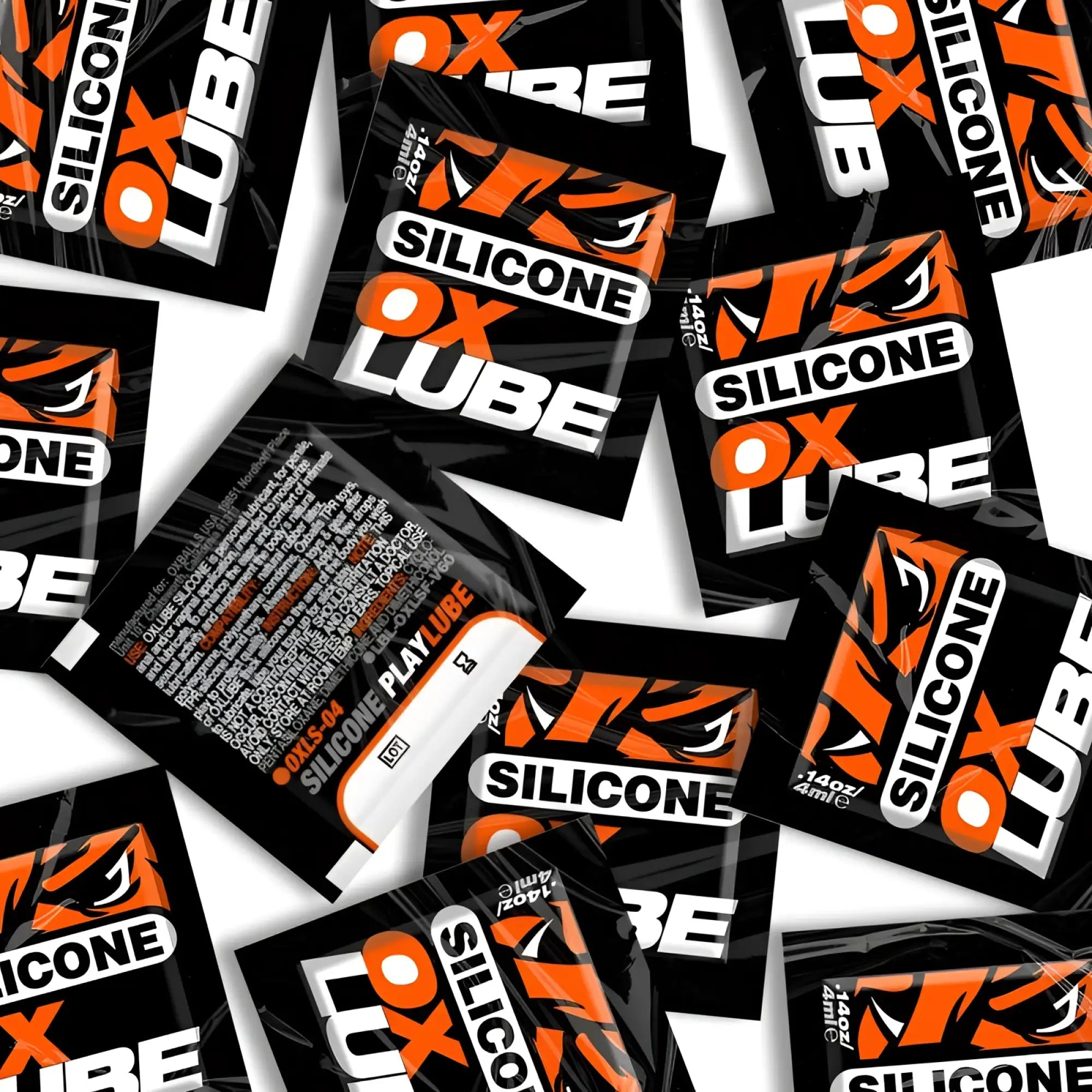 Black and orange silicone lube packets with bold white oxballs branding thick OXLube 50 pack sachets