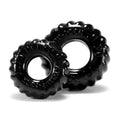 Black glossy tire-shaped silicone cockrings with embossed text from oxballs truckt 2 pc set