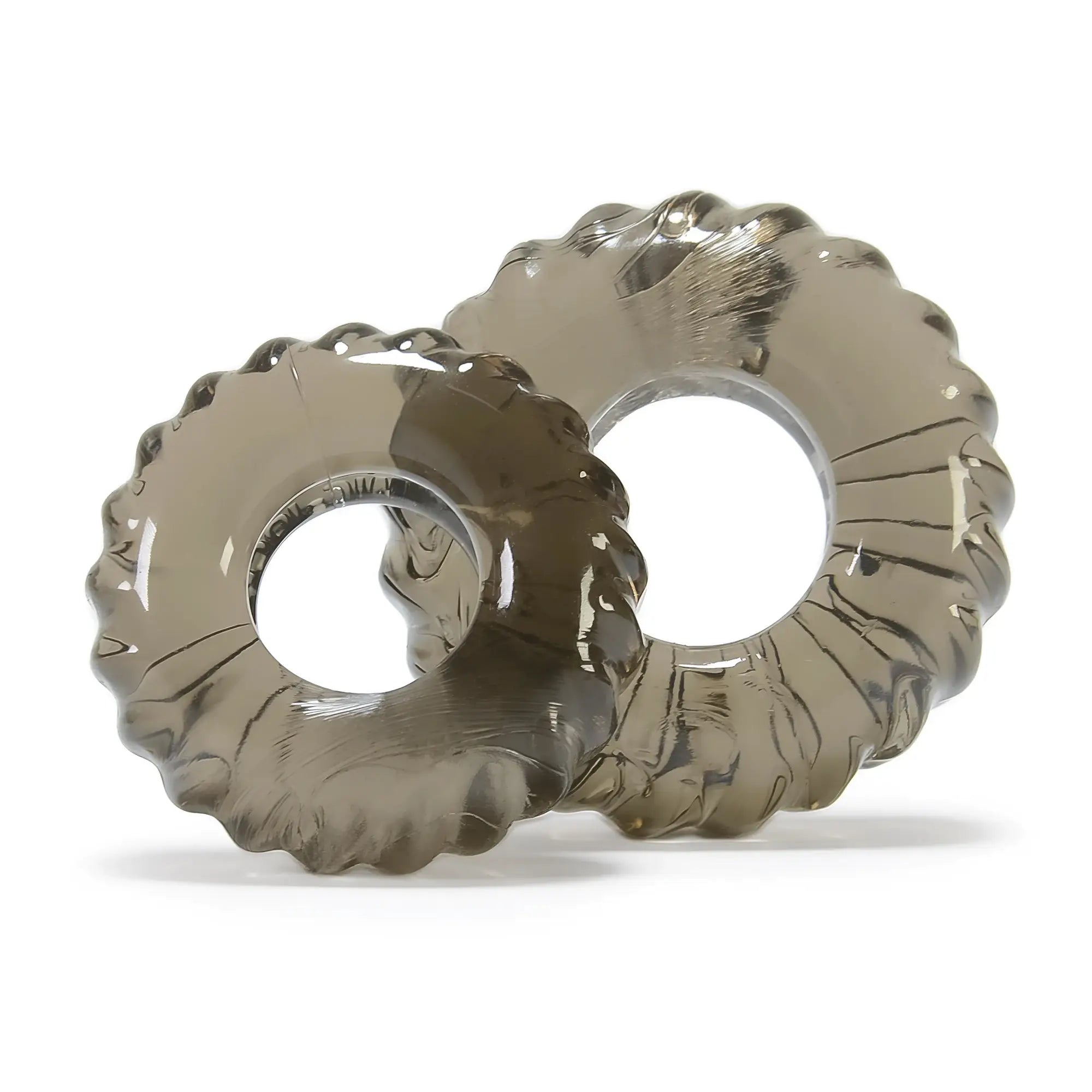 Two translucent gray silicone cockrings with textured scalloped edges from the oxballs truckt 2 pc set clear