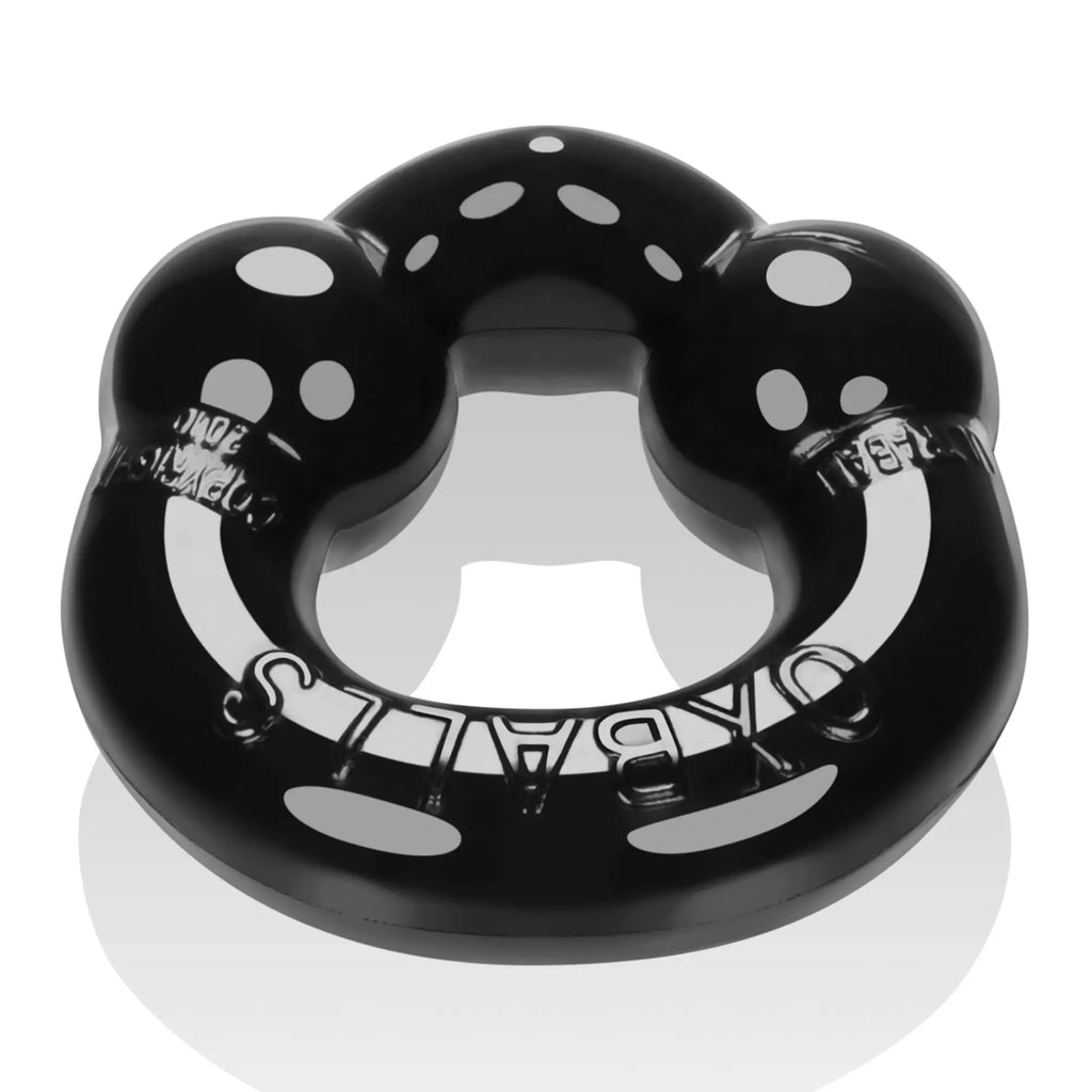 Black glossy plastic oral guard with white polka dots and embossed oaballs branding from oxballs ultraballs 2 pk