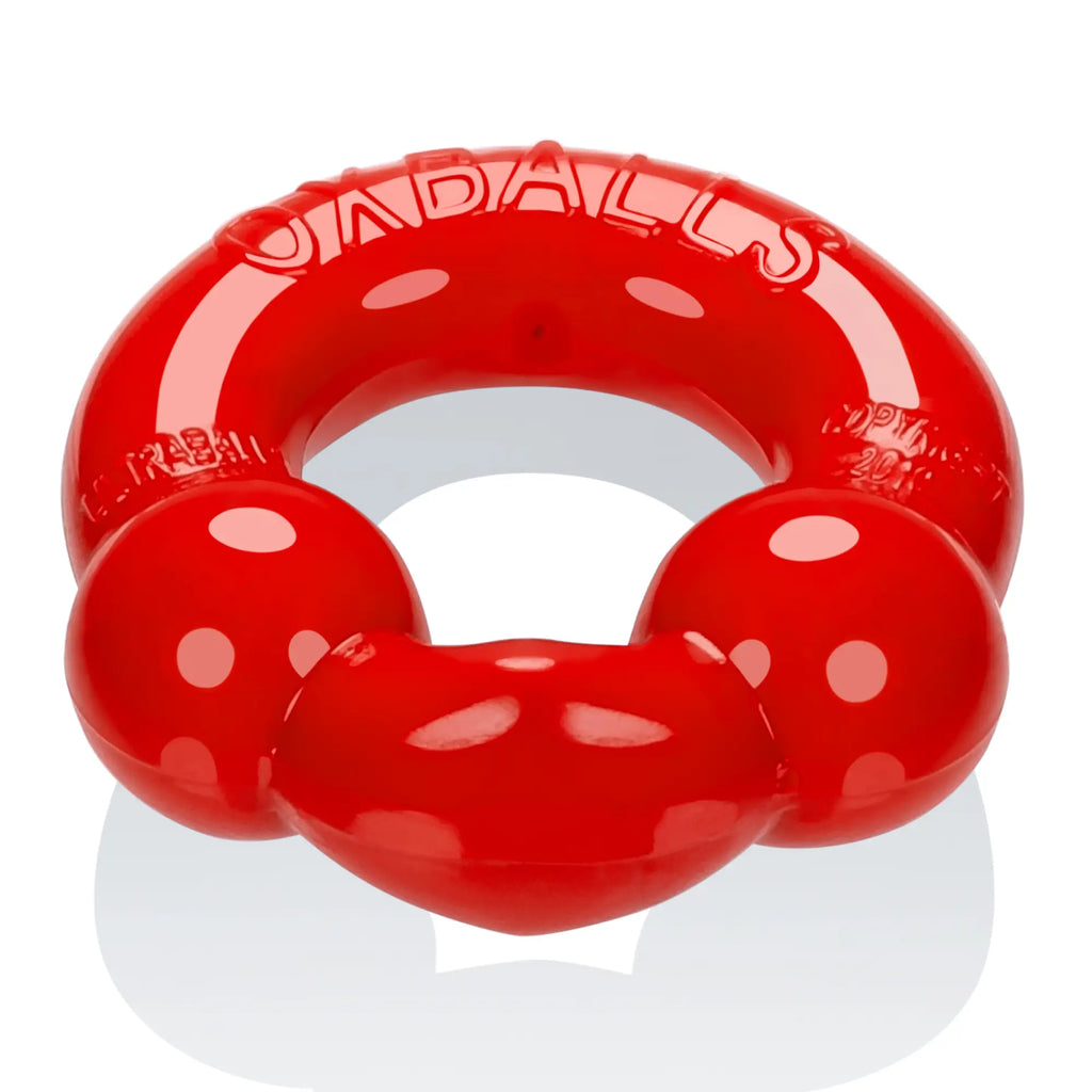 Red glossy plastic dog toy shaped like a ring with two rounded protrusions from oxballs ultraballs 2 pk cockring steel and red