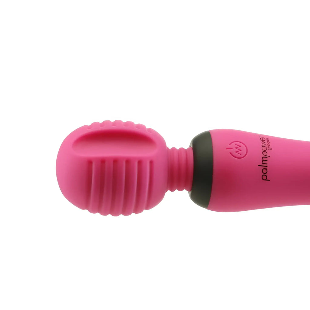 Pink silicone palmsonic massager palmpower groove mini wand with ribbed head and black power button in fuchsia