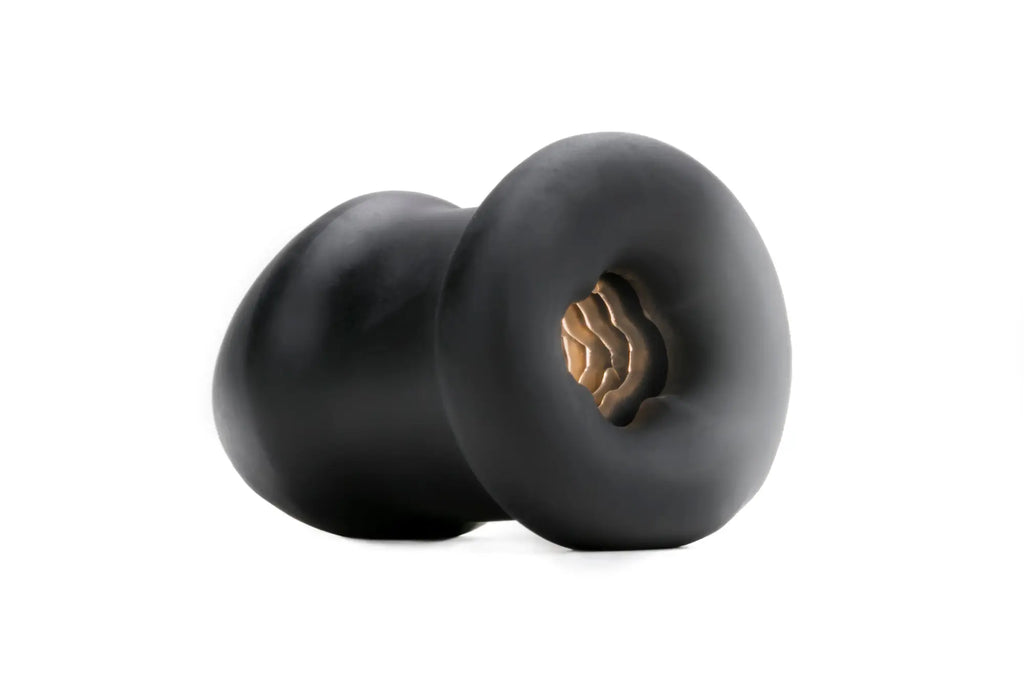 Black silicone neck massager with gold internal core designed for perfectfit buck angel buck off ftm stroker use