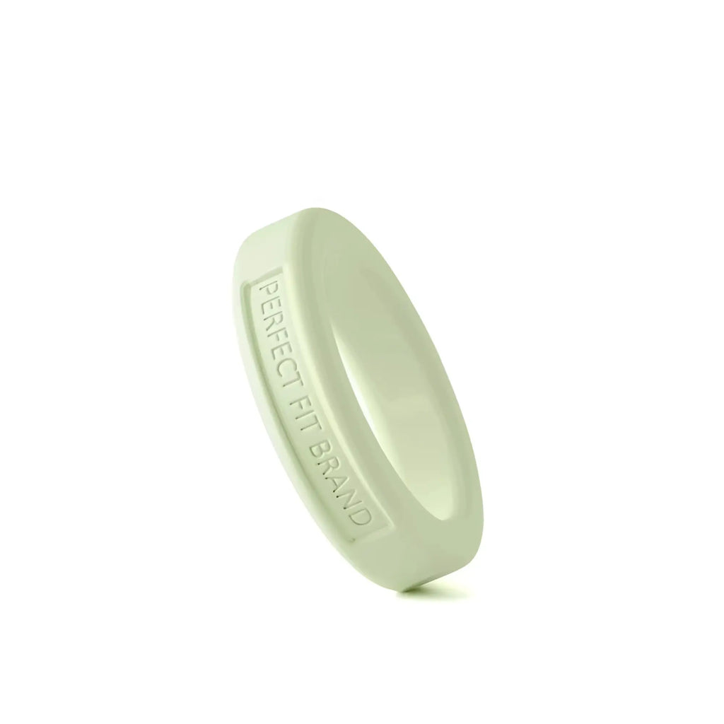 A sleek matte light green silicone medium stretch penis ring with perfect fit brand engraving inside