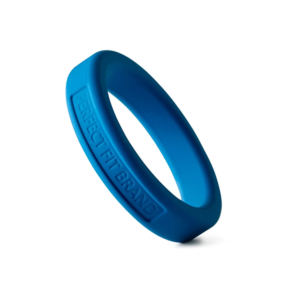A vibrant blue perfectfit classic silicone medium stretch penis ring with engraved text on its inner surface