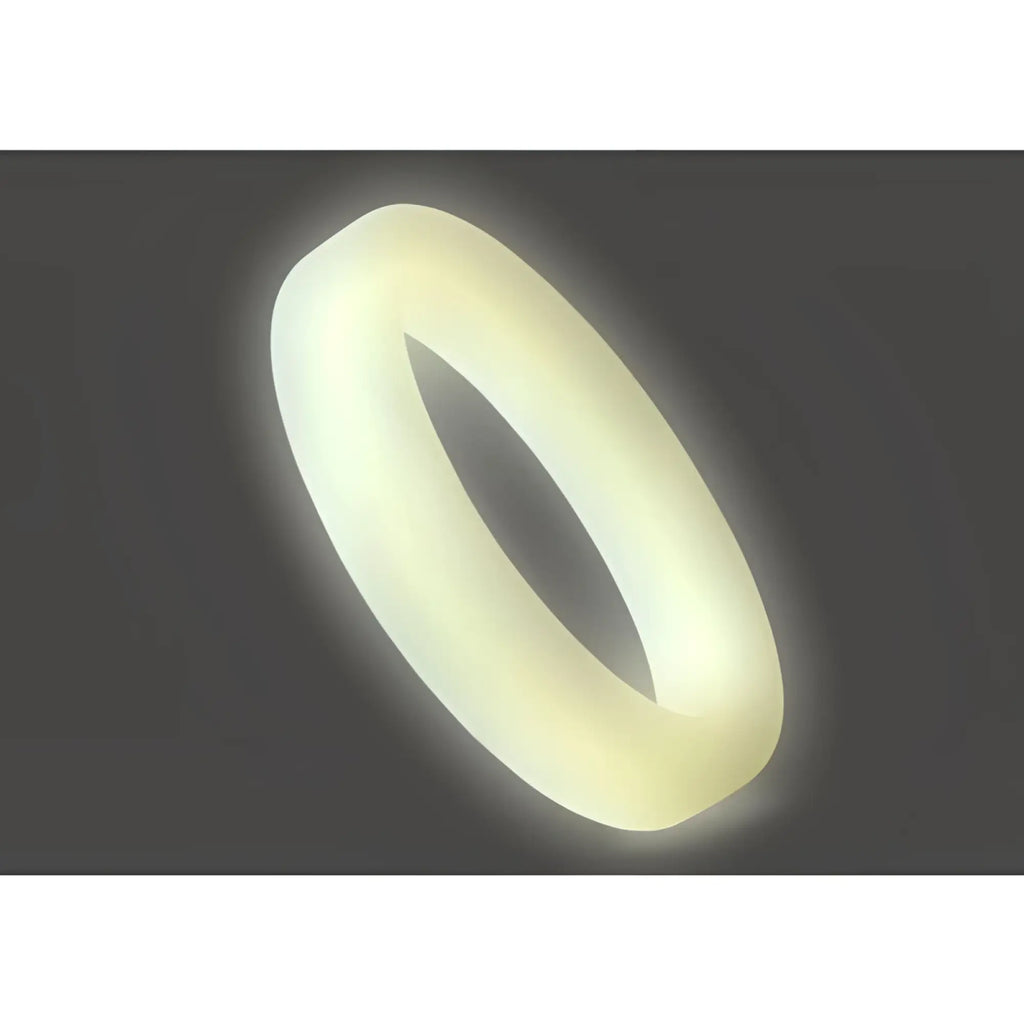 A soft glowing off-white silicone perfectfit classic medium stretch penis ring with a smooth rounded design