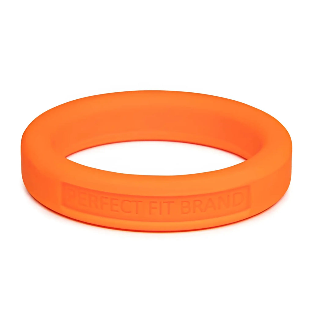 Bright orange medium stretch silicone penis ring embossed with PerfectFit brand on the inner band