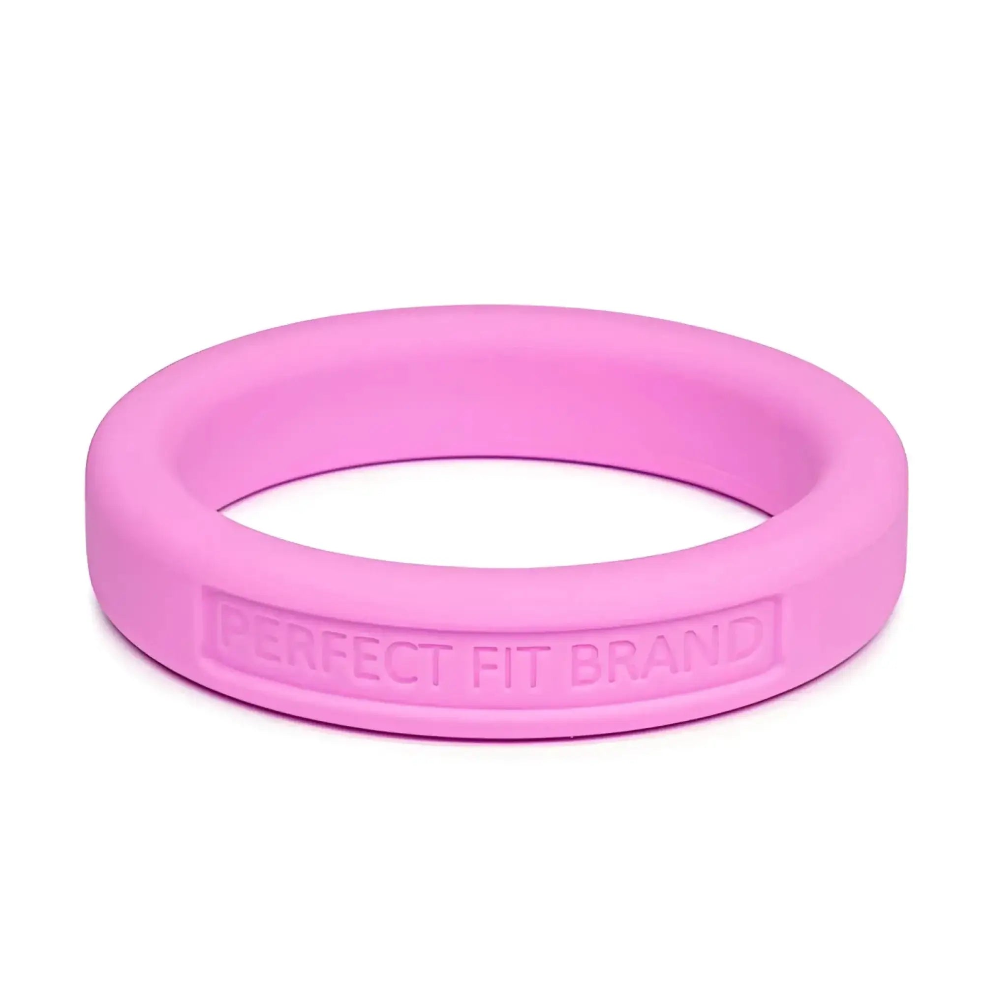 A sleek pink silicone medium stretch penis ring with perfect fit brand engraved on its inner edge