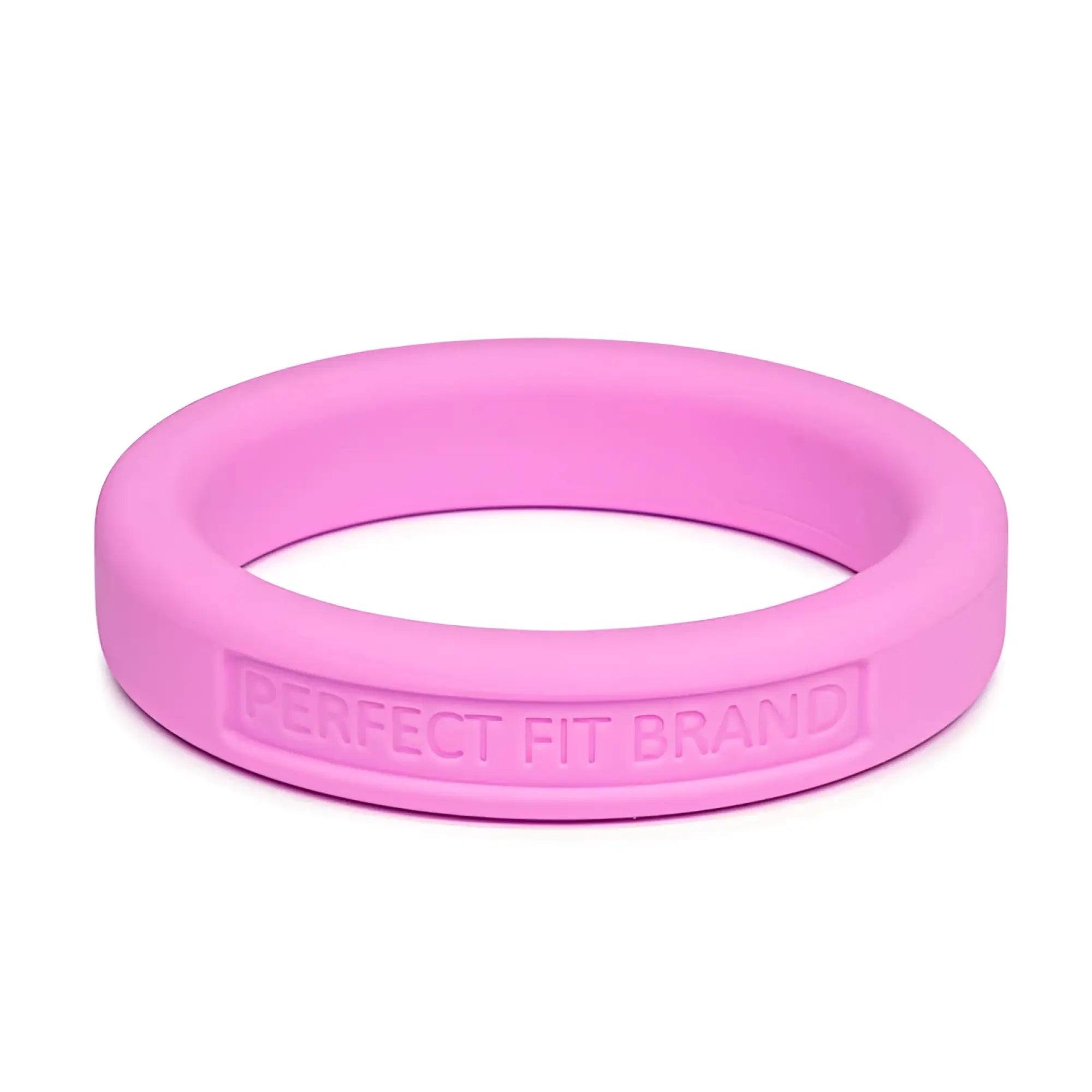 A sleek pink silicone medium stretch penis ring with perfect fit brand engraved on its inner edge