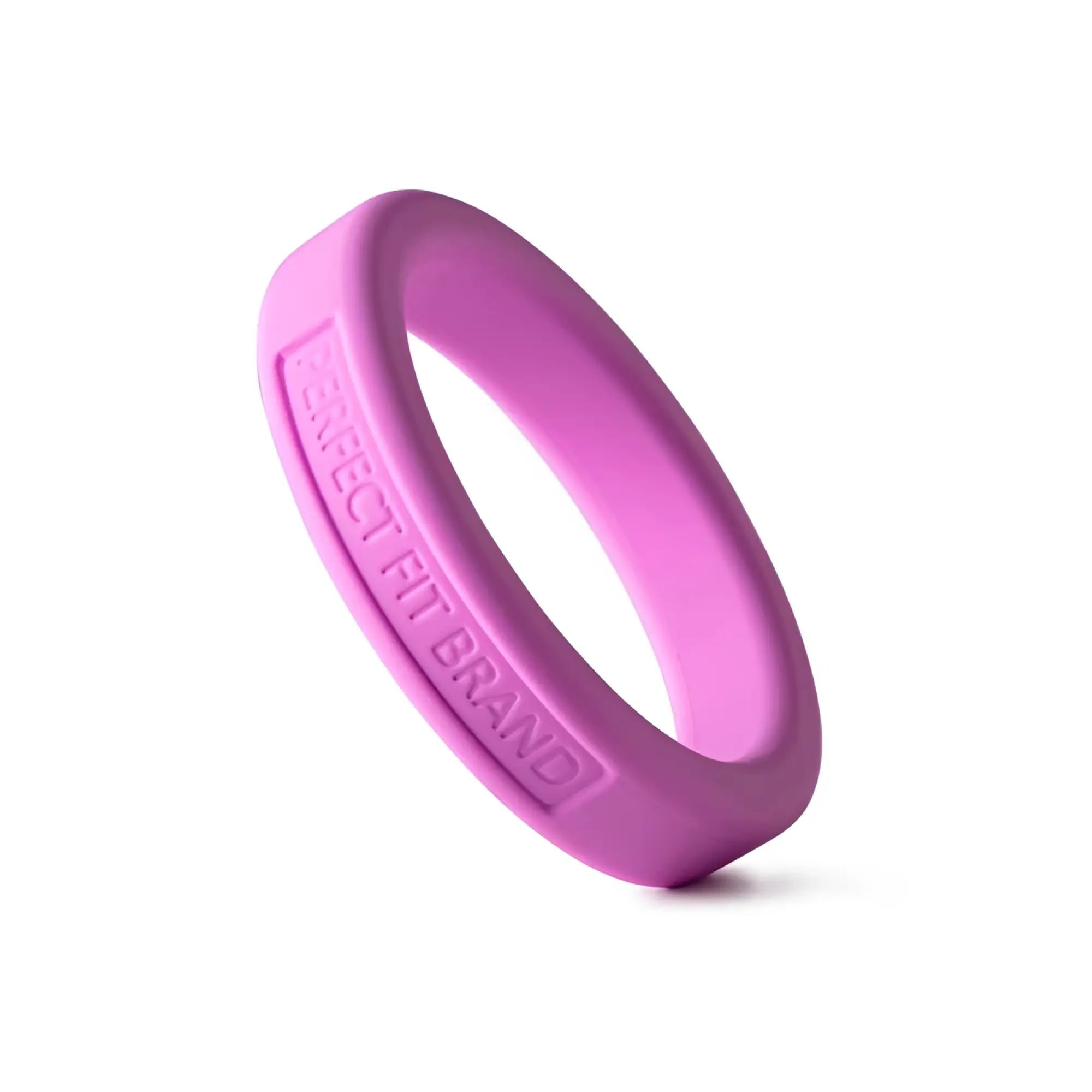 A vibrant pink silicone medium stretch penis ring by perfectfit classic with engraved perfect fit brand text inside