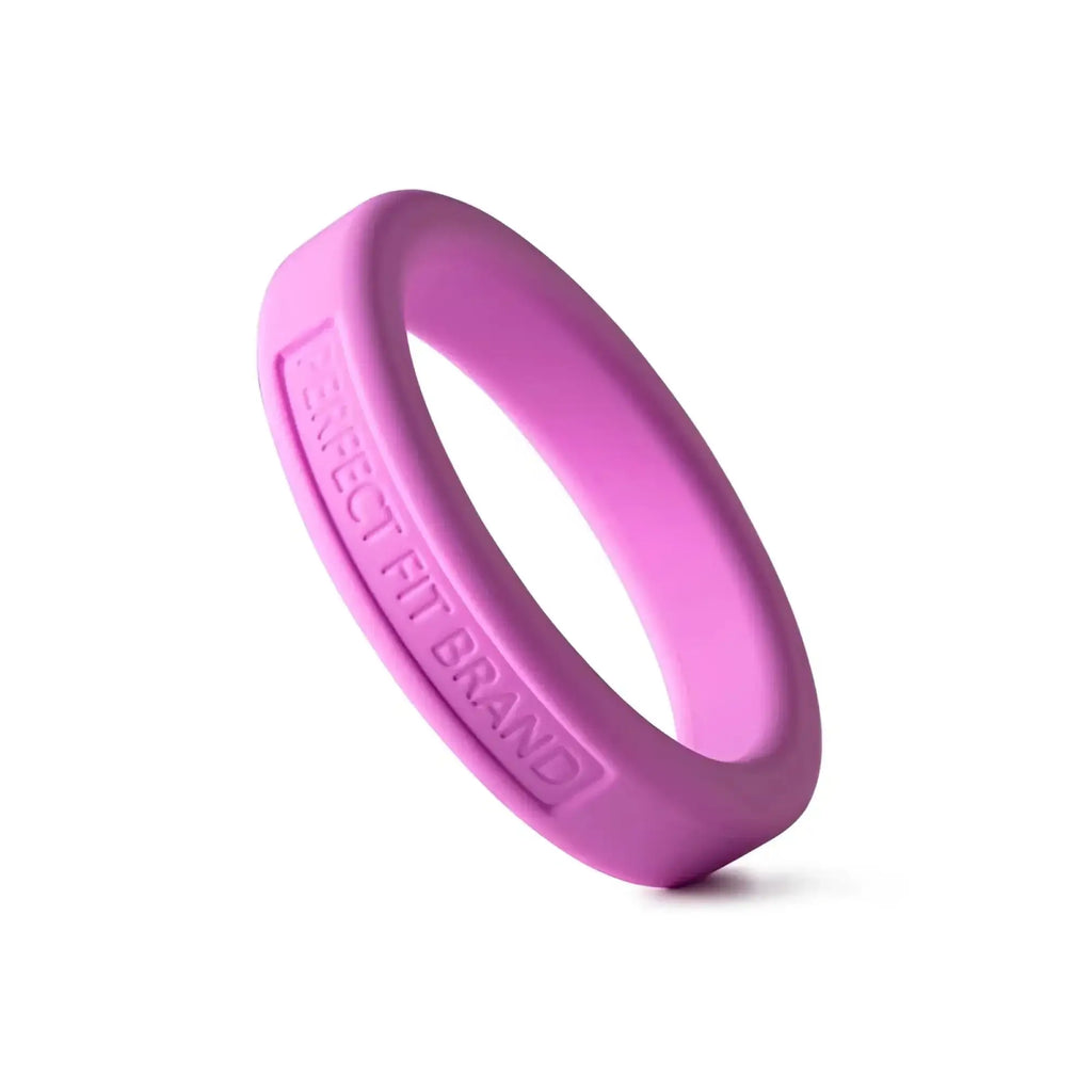 A vibrant pink silicone medium stretch penis ring by perfectfit classic with engraved perfect fit brand text inside