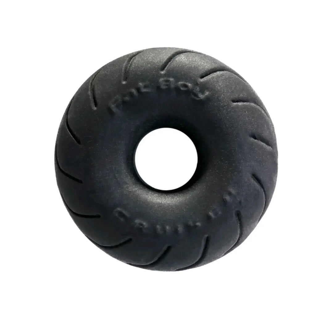 Black rubber donut-shaped PerfectFit Cruiser Ring 2.5in with tire tread pattern and embossed text made of SilaSkin