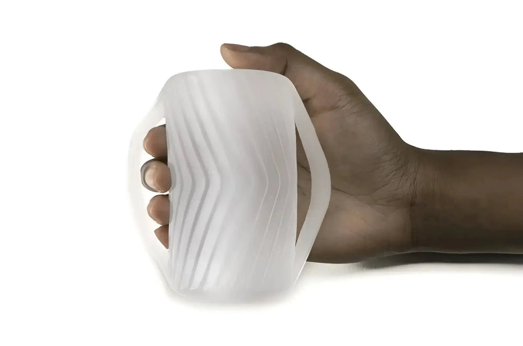 White translucent silicone grip with wavy ridged texture and integrated handle for perfectfit male masturbator gripped
