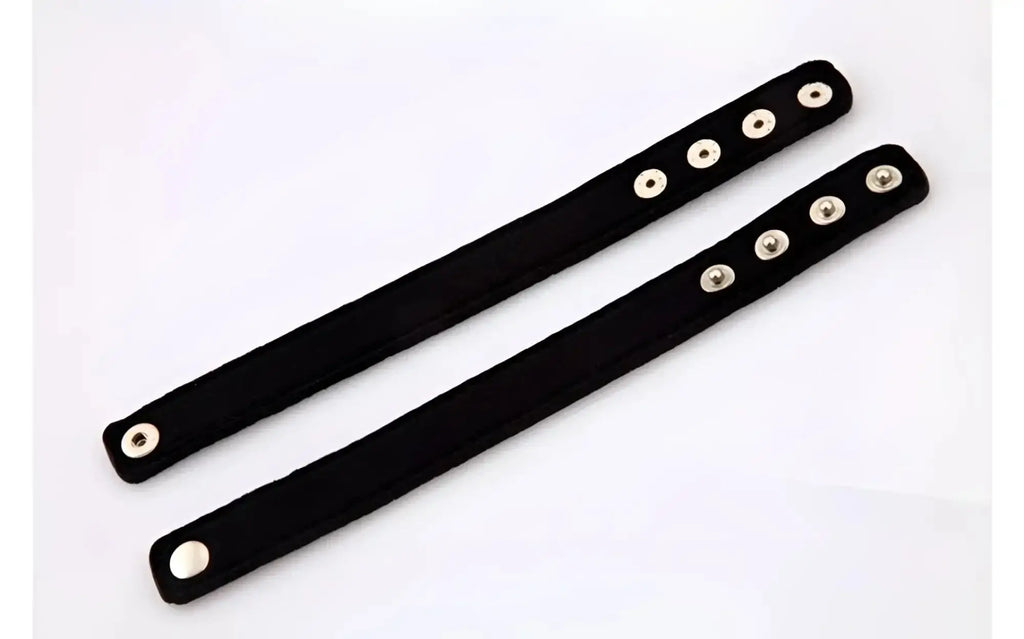 Black suede wristbands with silver-toned snap buttons from perfectfit neoprene snap cockrings collection