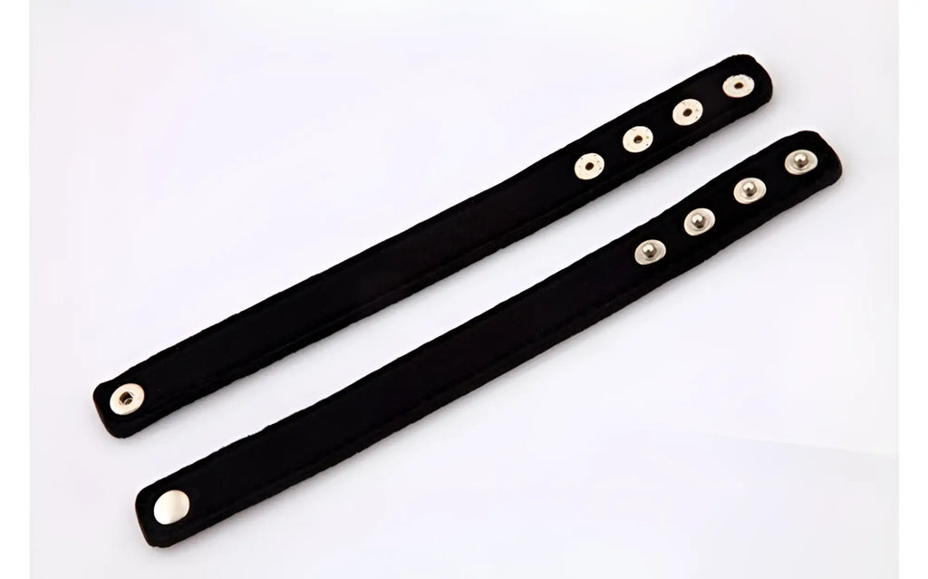 Black suede wristbands with silver-toned snap buttons from perfectfit neoprene snap cockrings collection