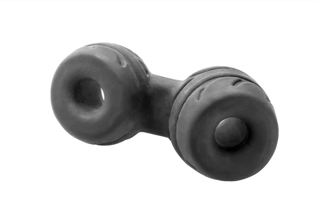 Black rubbery dumbbell-shaped connector from perfectfit silaskin cock and ball for comfortable secure fit