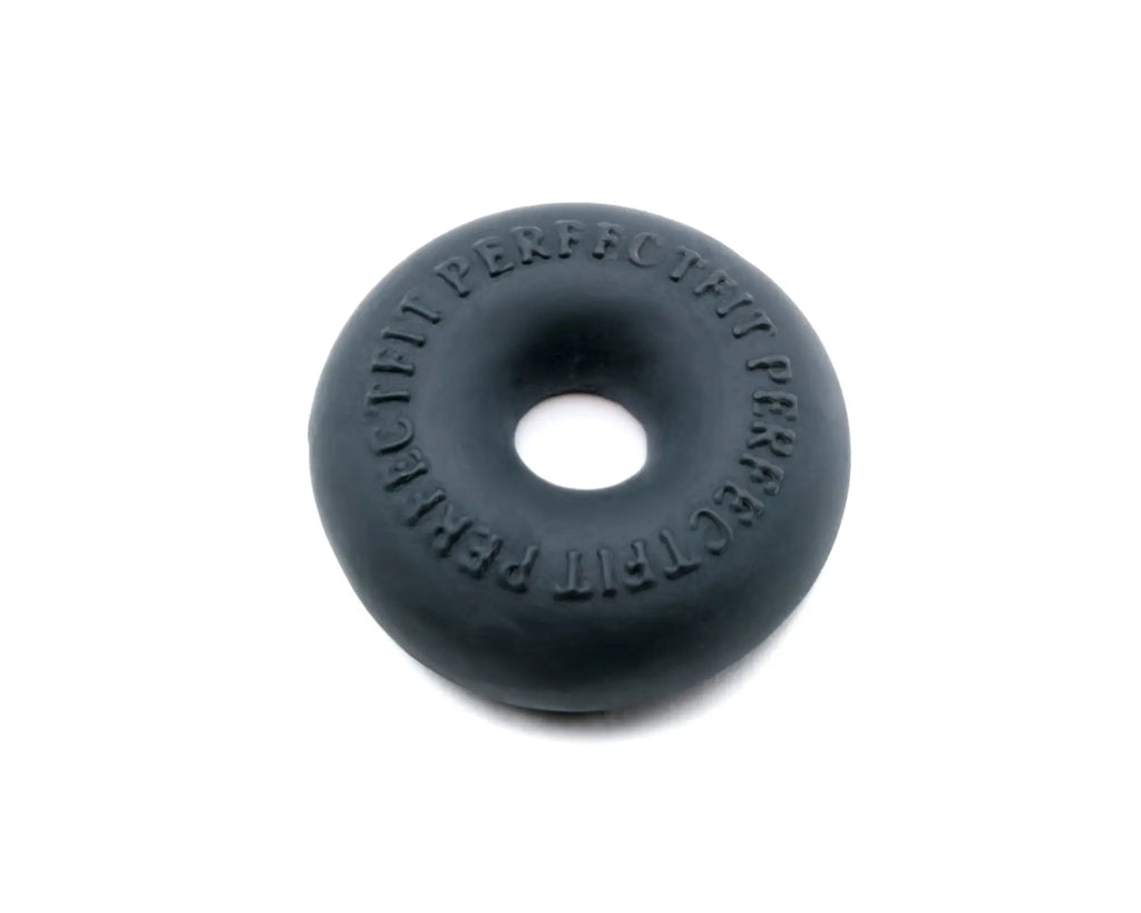 Black rubber donut with embossed text around its edge from the PerfectFit Stackit Black product line