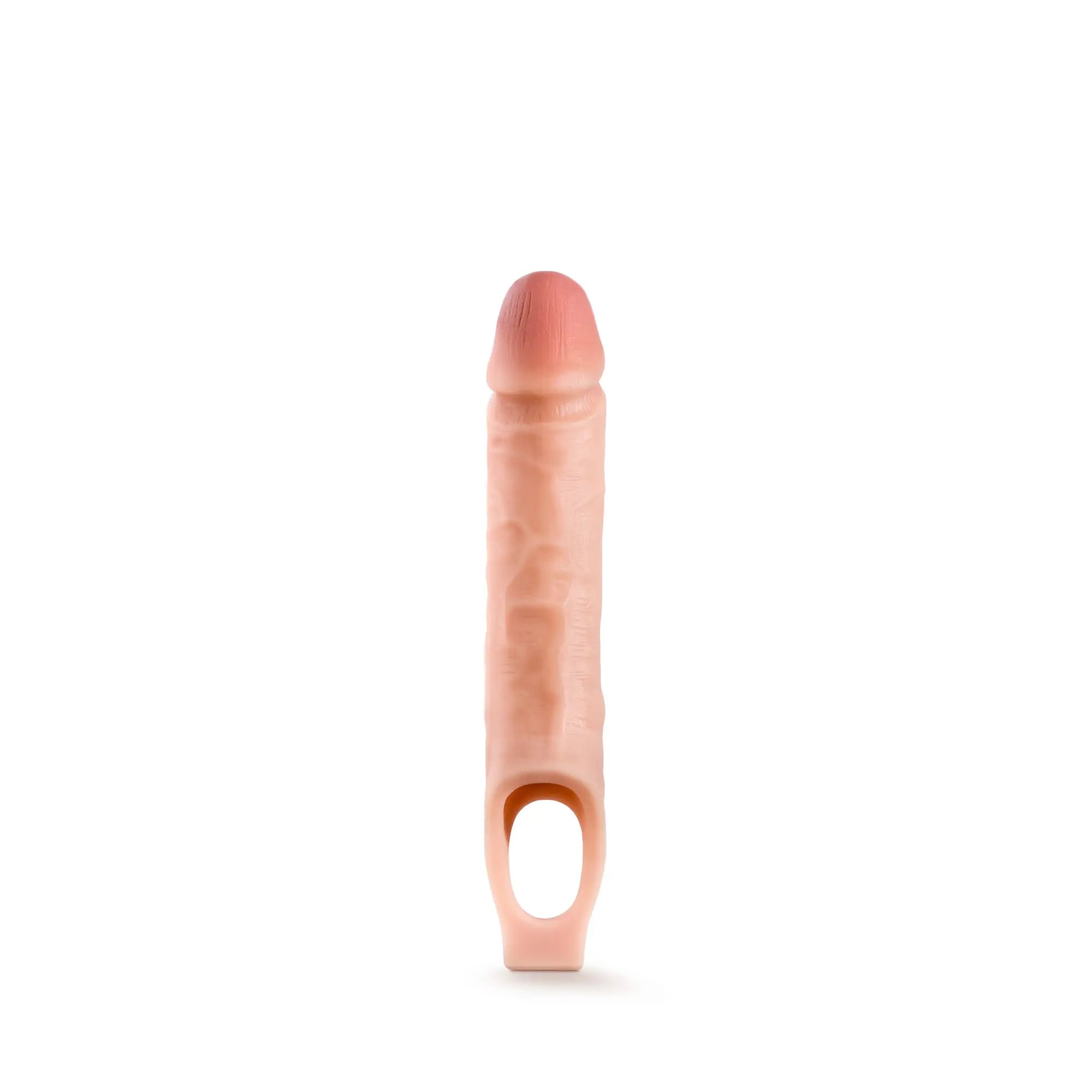 Peach-colored silicone 10in cock sheath penis extender with textured surface and oval base opening for performance use