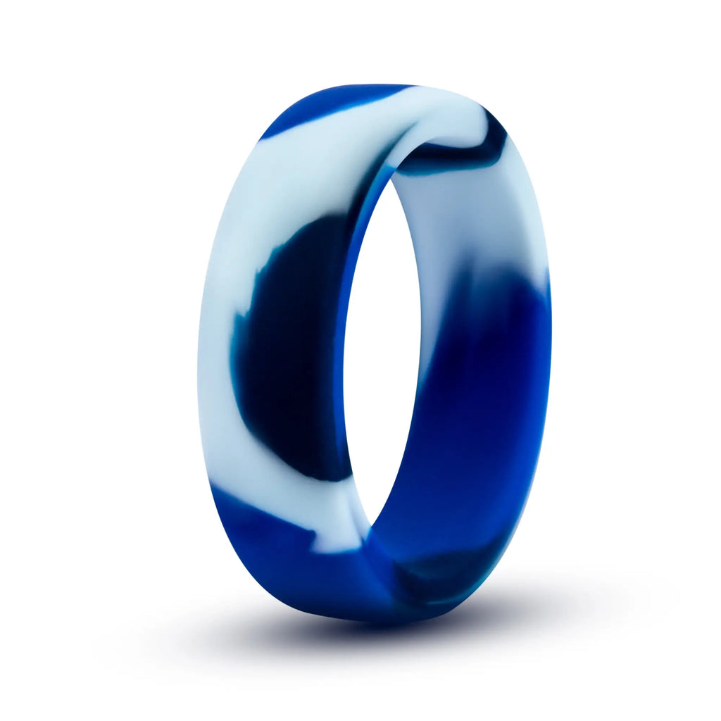 A sleek modern performance silicone camo cock ring with a swirling deep blue and white pattern