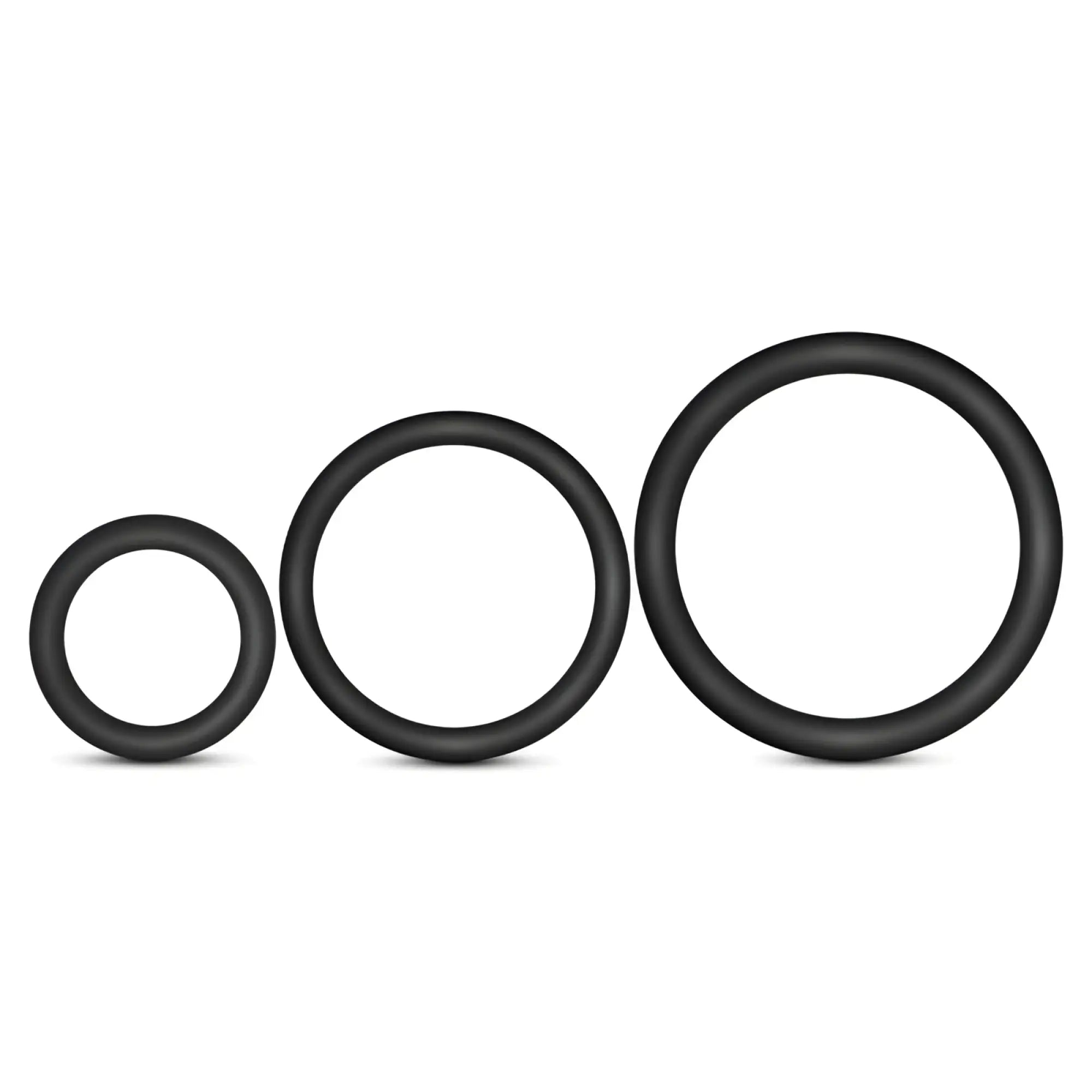 Three black silicone cock rings in varying sizes arranged in a row from the performance silicone 3 pc set