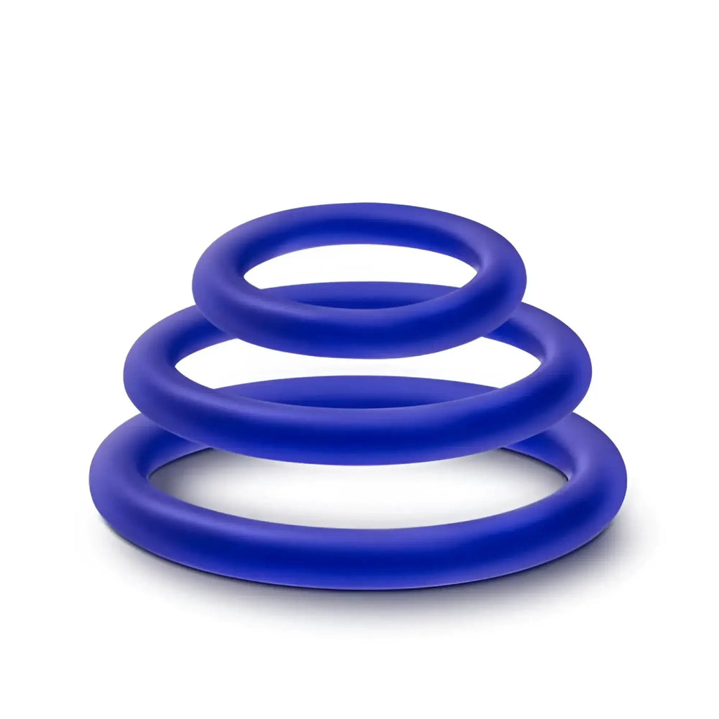 Set of three vibrant royal blue silicone cock rings in graduated sizes from the performance indigo 3 pc set