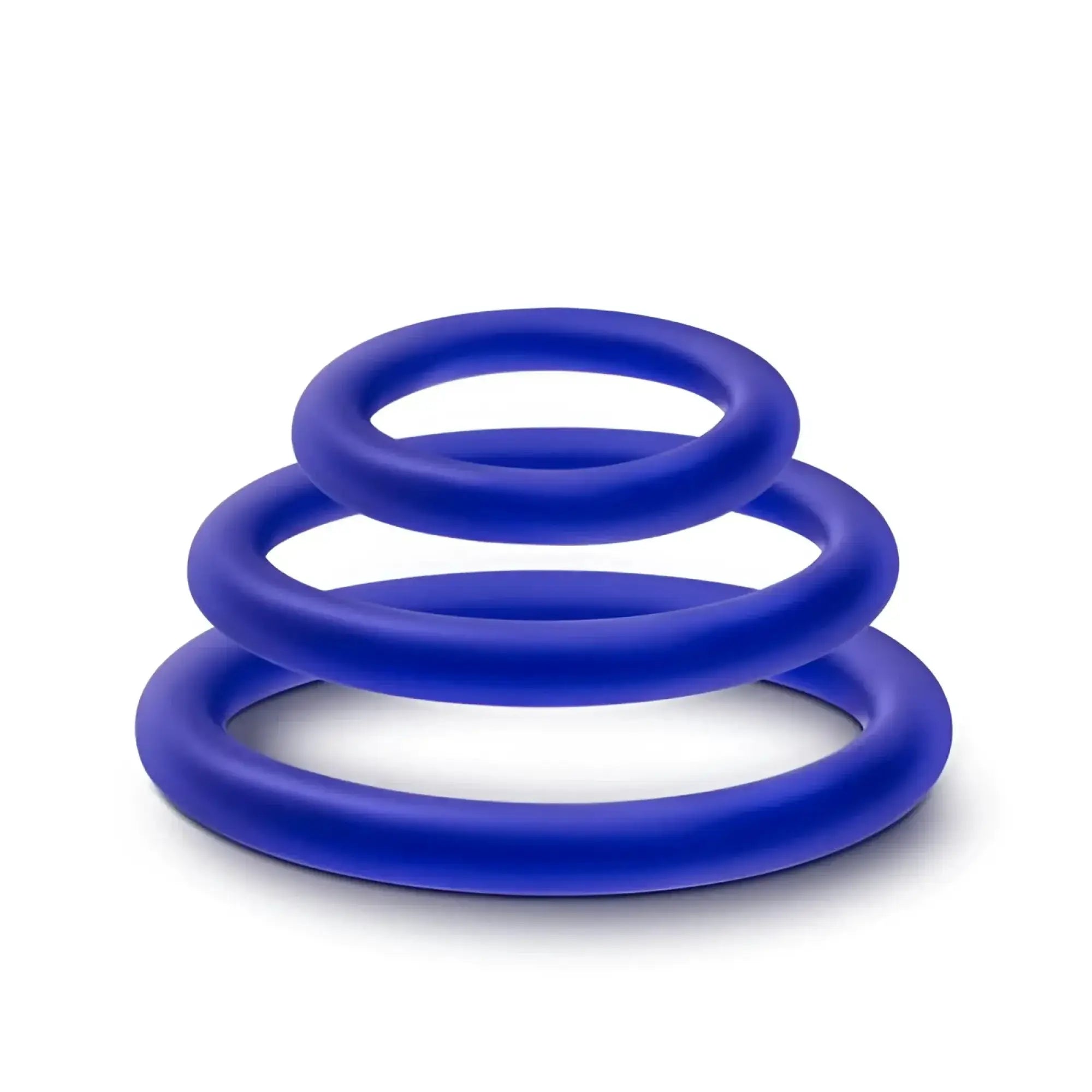 Set of three vibrant royal blue silicone cock rings in graduated sizes from the performance indigo 3 pc set