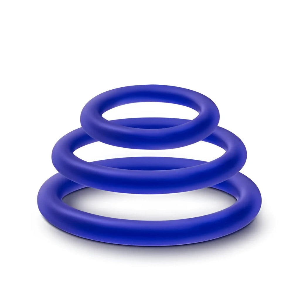 Set of three vibrant royal blue silicone cock rings in graduated sizes from the performance indigo 3 pc set