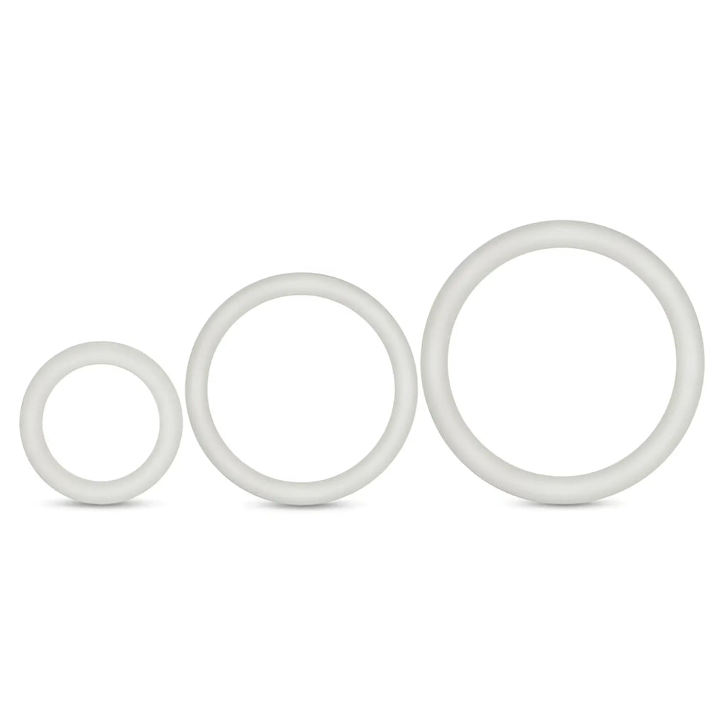 Set of three white silicone performance cock rings in varying sizes designed for comfortable use and glow effect