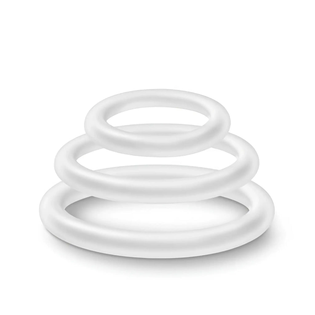 Set of three white silicone cock rings in varying sizes stacked together performance silicone glow