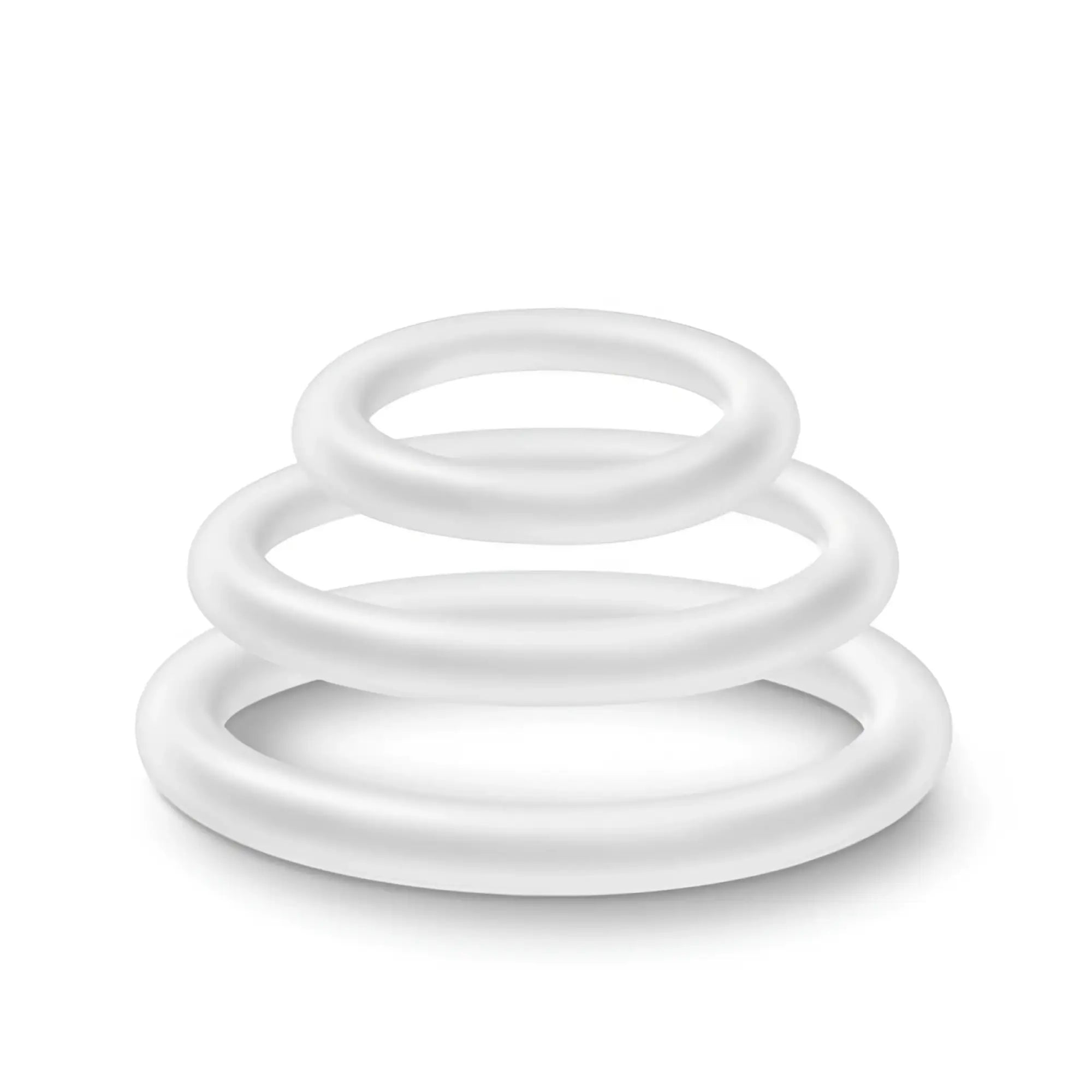 Set of three white silicone cock rings in varying sizes stacked together performance silicone glow