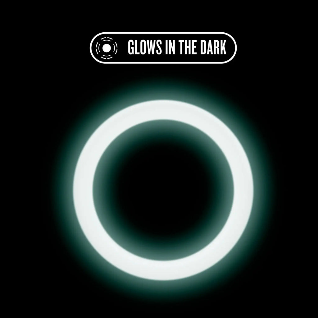 Performance silicone glo cock ring in blue glow featuring a glowing white circular ring with soft luminous light
