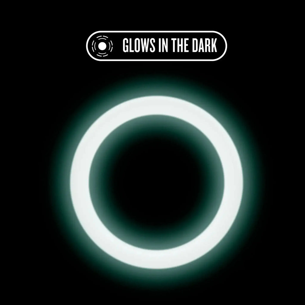 Performance silicone glo cock ring in blue glow featuring a glowing white circular ring with soft luminous light
