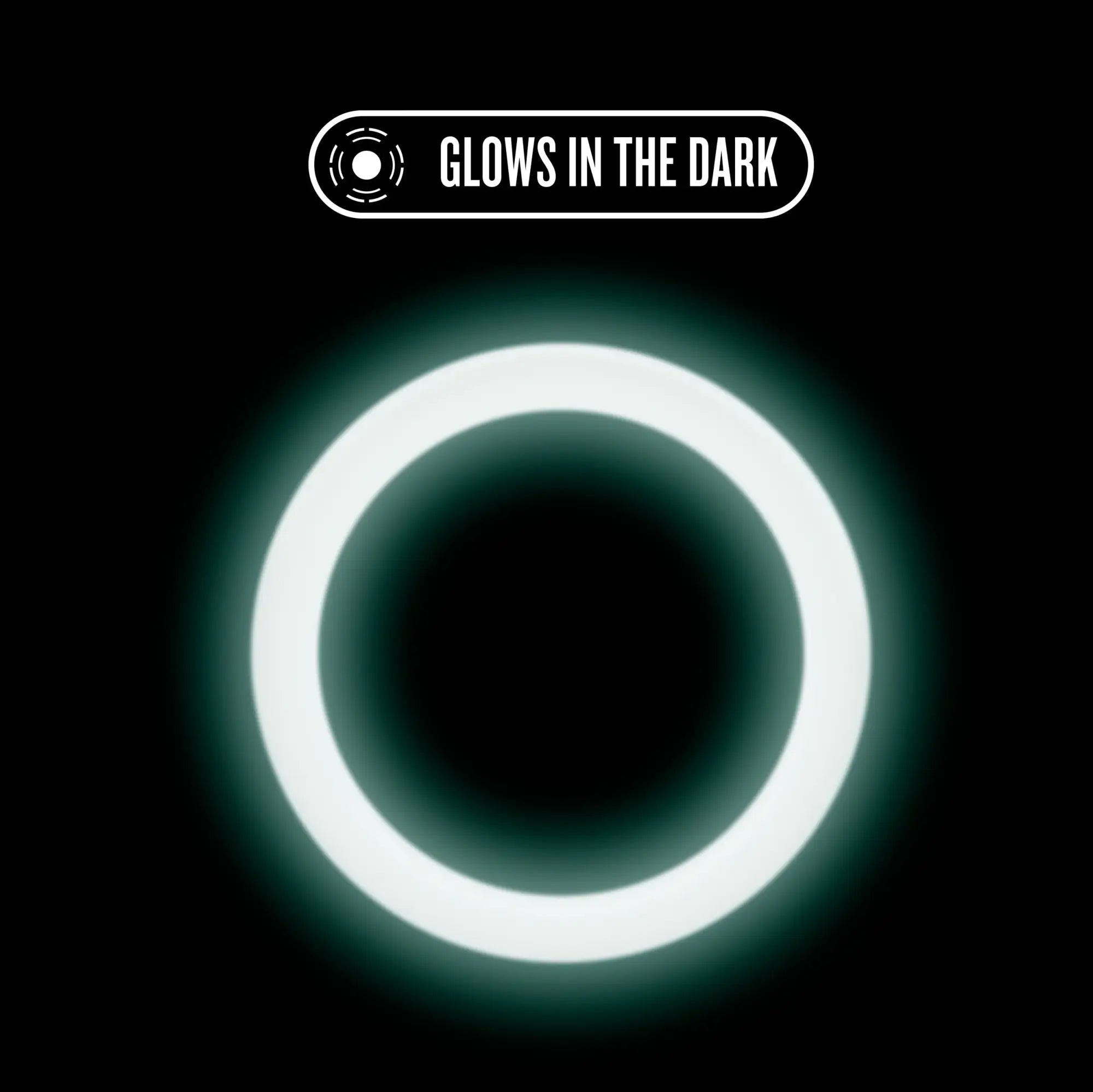 Performance silicone glo cock ring in white glow emitting a soft luminous light against a black background