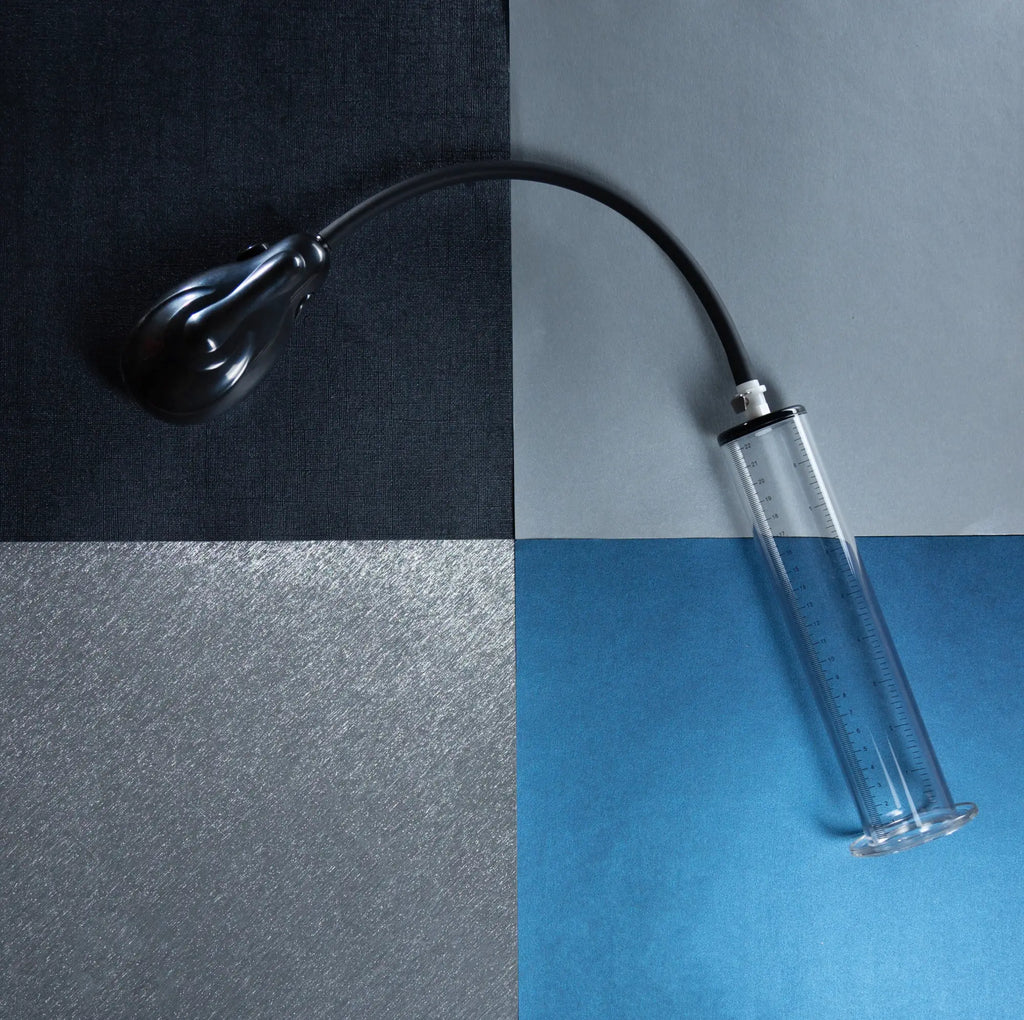 Black plastic syringe with clear glass barrel and measurement markings for performance vx9 auto penis pump clear