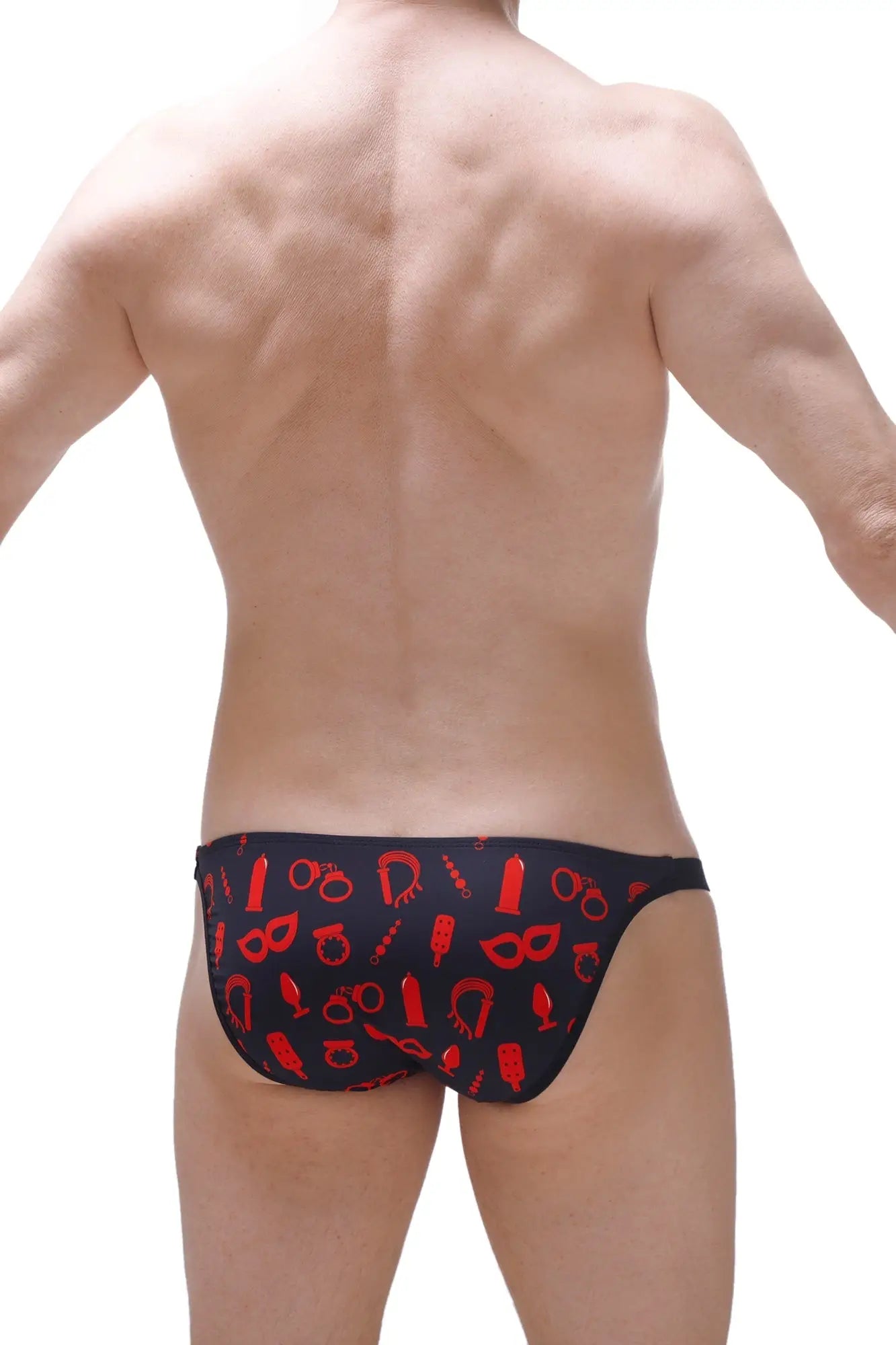 Black PetitQ bikini Auzits Boudoir swim trunks with bold red erotic symbol pattern front view