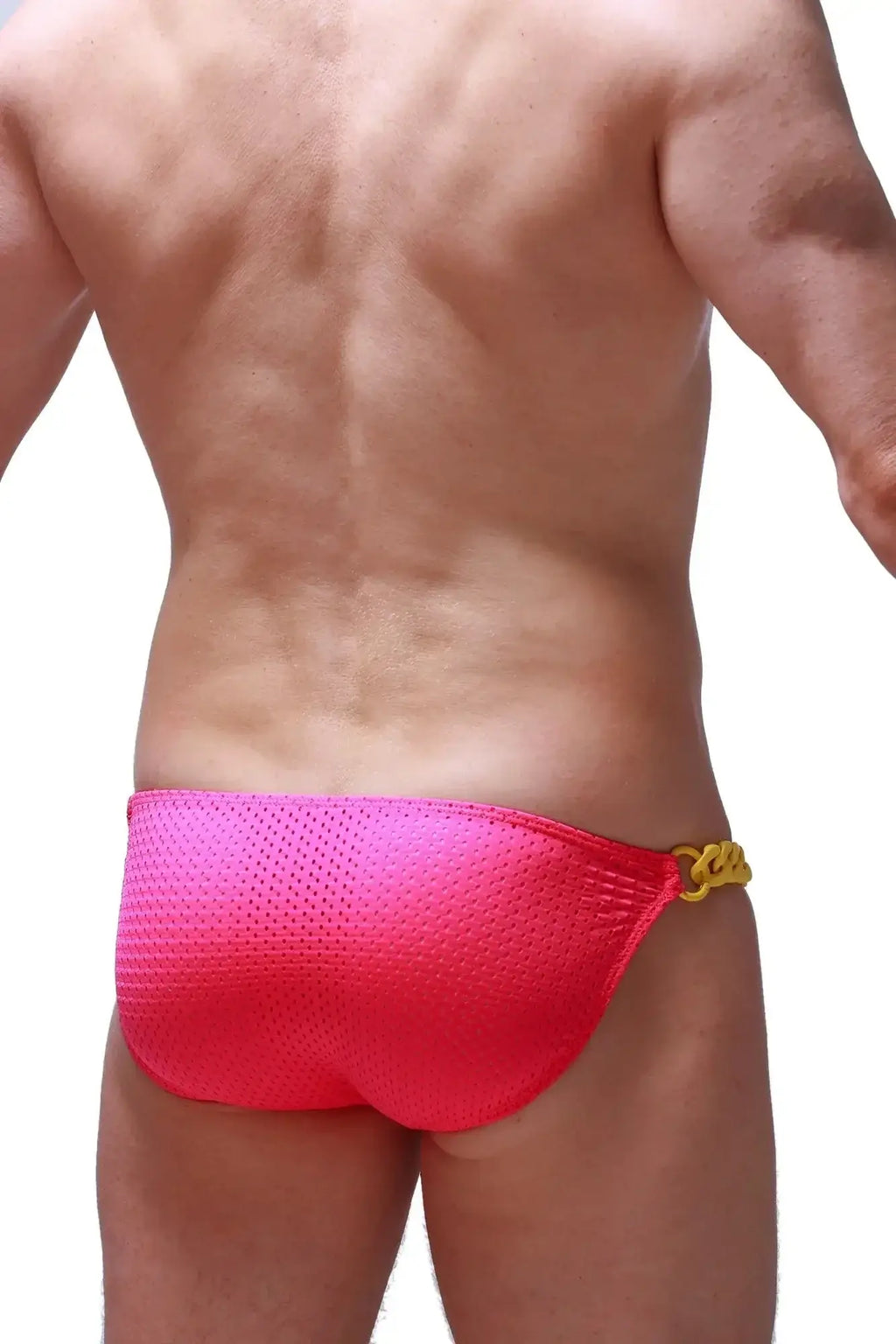 Bright pink mesh swim trunks with gold chain waistband accent from petitq bikini chains bee pink collection