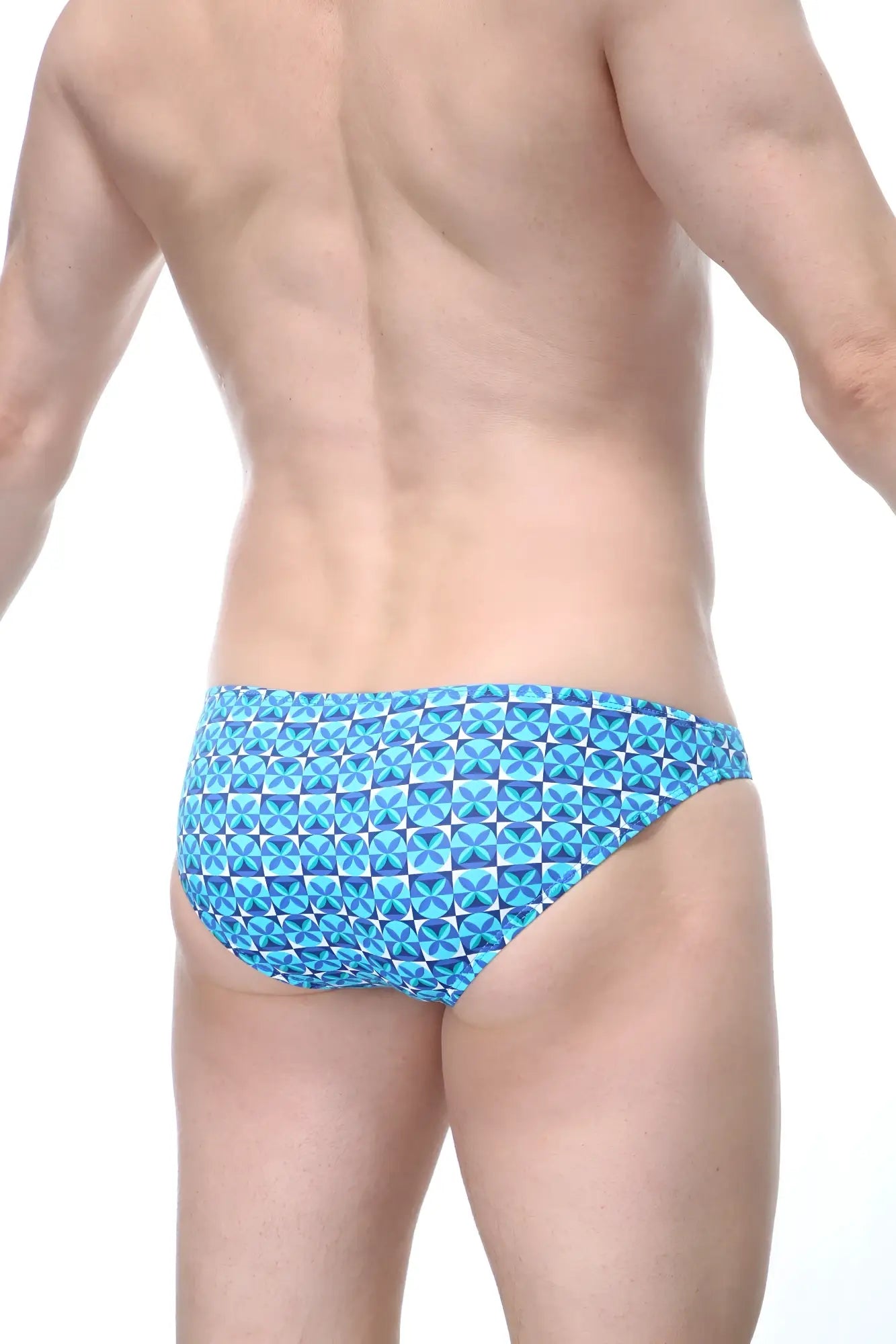 Blue patterned swim trunks with geometric design from petitq bikini colline vaucelles for casual beachwear