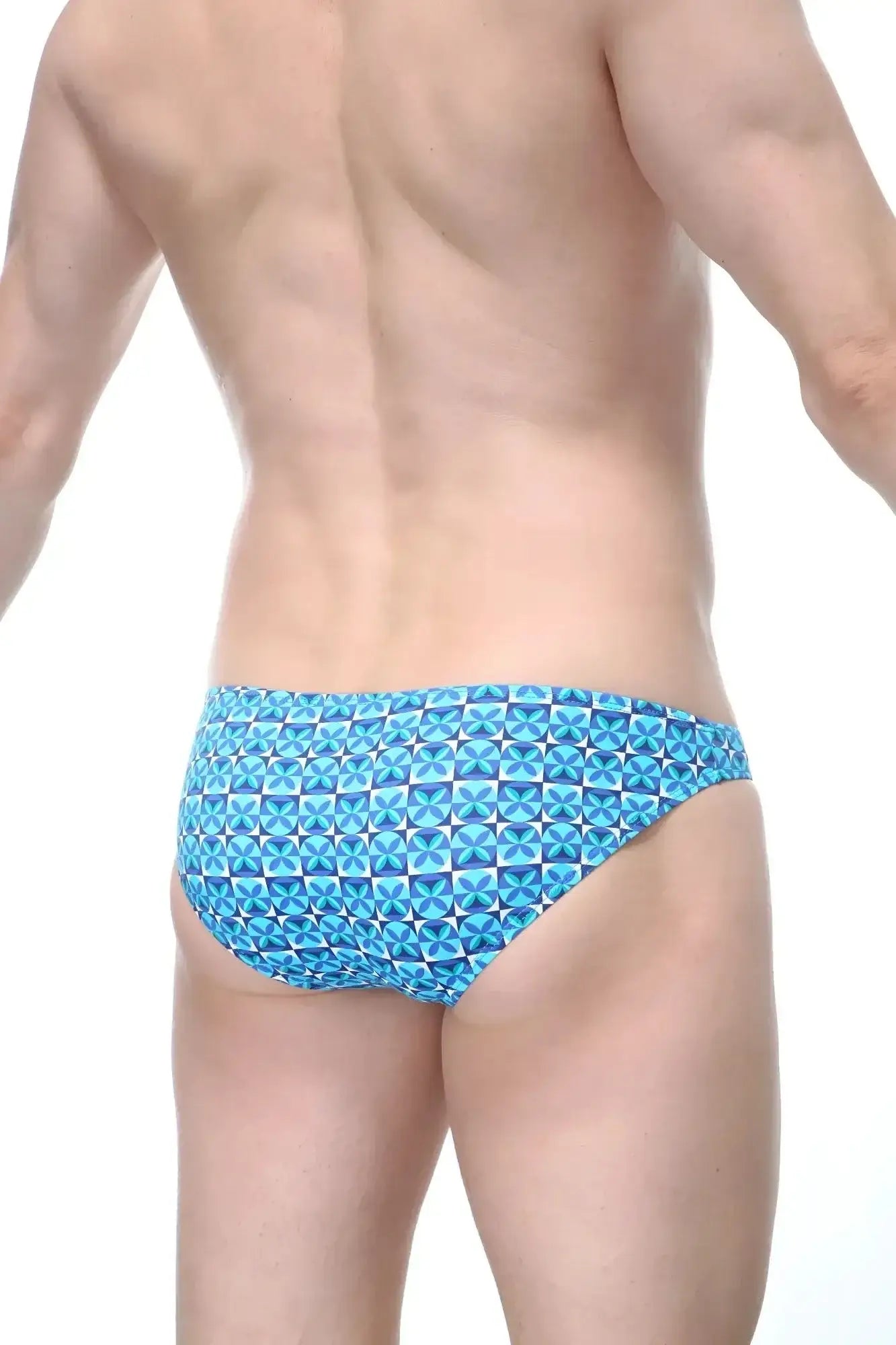Blue patterned swim trunks with geometric design from petitq bikini colline vaucelles for casual beachwear