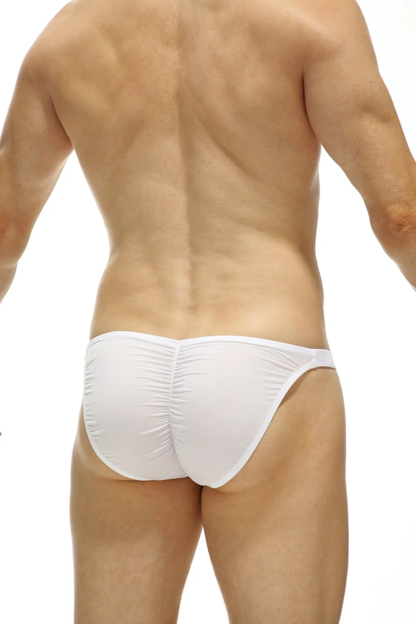 Back view of petitq bikini cornil bulan white white form-fitting swim trunks with ruched back design