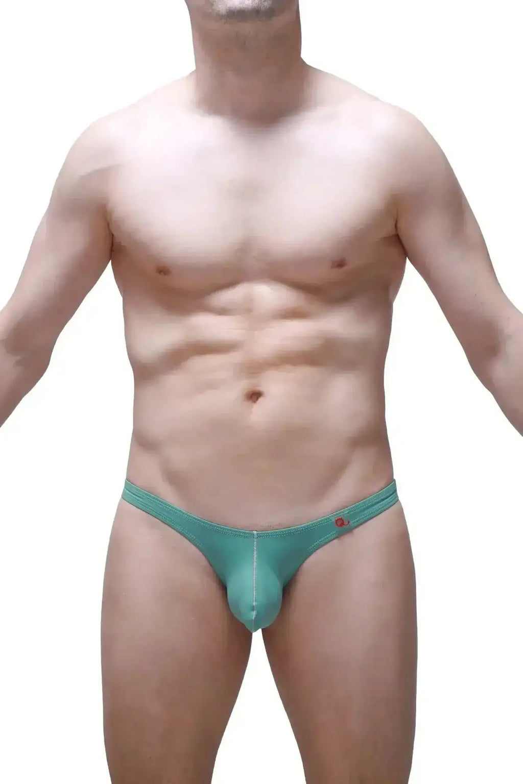 Teal-colored form-fitting men’s thong with subtle seam detail and small red logo on waistband petitq bikini dome green